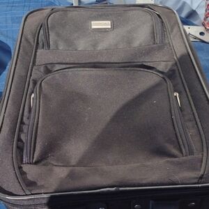 Essentials Travel Suitcase with handles and wheels